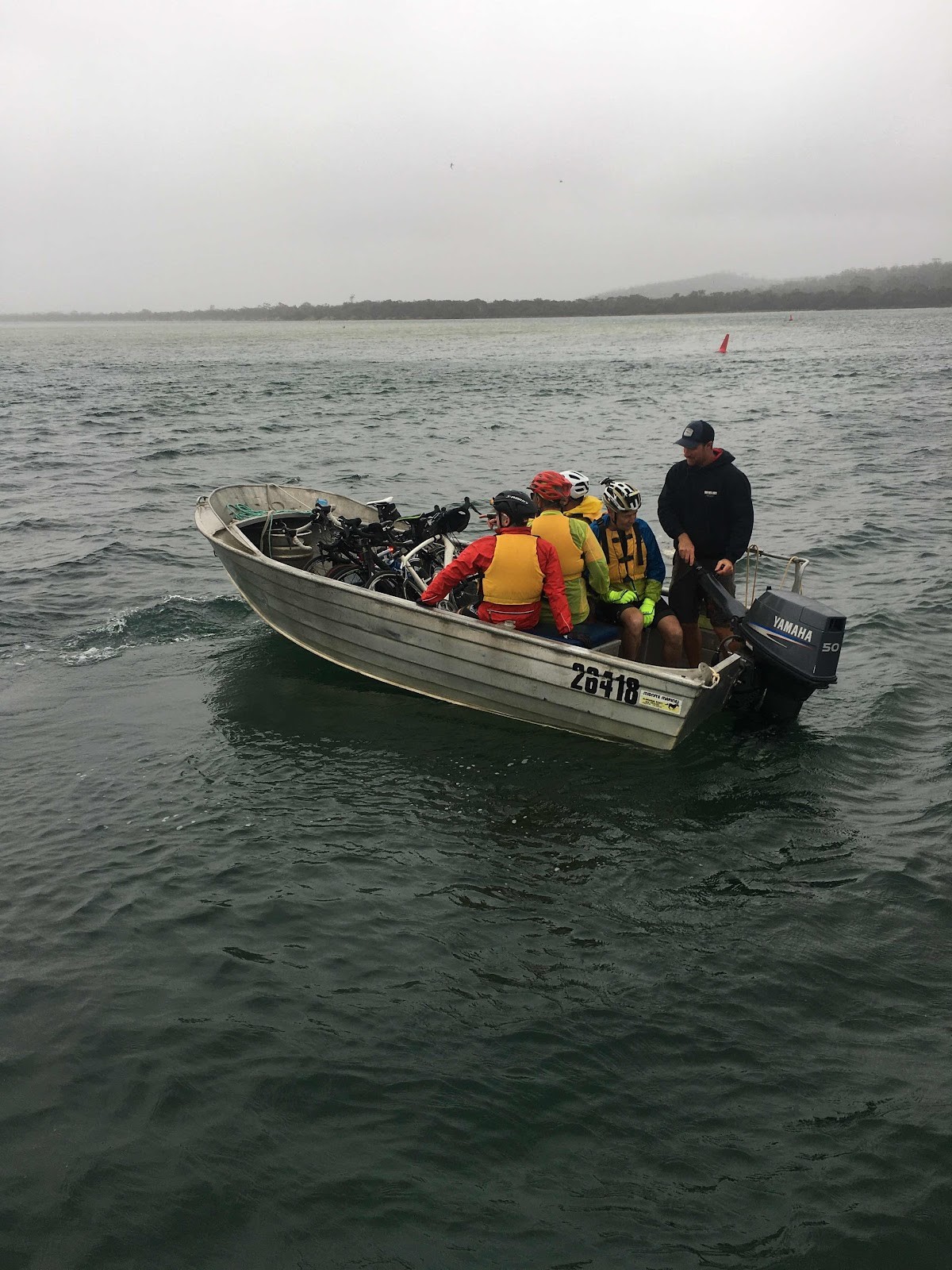 Wheeliebinners and their bikes crossing by boat in Tasmania